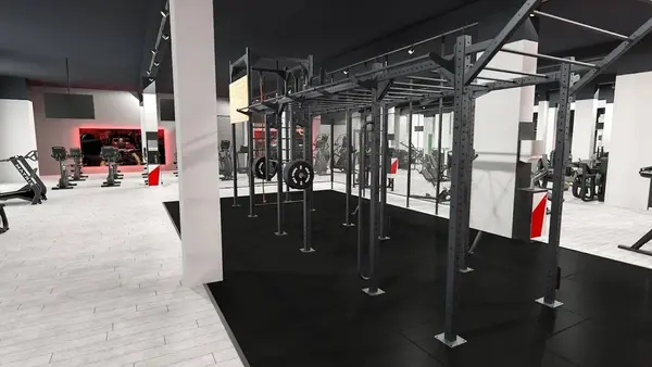 Moderner Fitnessraum mit Kraftstation, Klimmzuggerüst und Cardio-Geräten